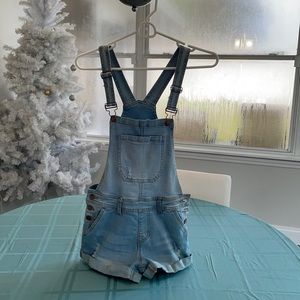 It’s a cute stretchy jean fabric overall shorts